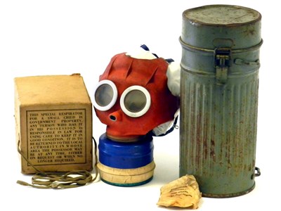 Lot 549 - A British Mickey Mouse respirator and and a WW2 German gas mask container