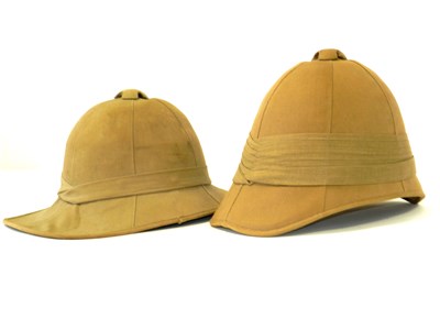 Lot 472 - Two khaki pith helmets