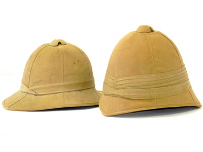 Lot 472 - Two khaki pith helmets