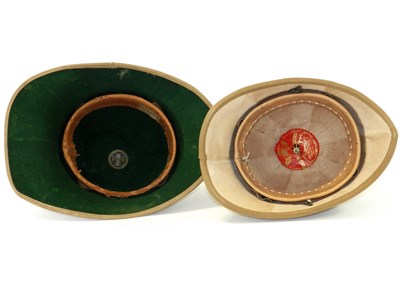 Lot 472 - Two khaki pith helmets