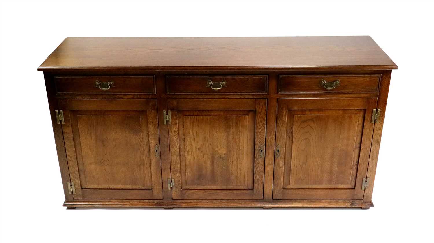 Lot 821 - A reproduction oak sideboard