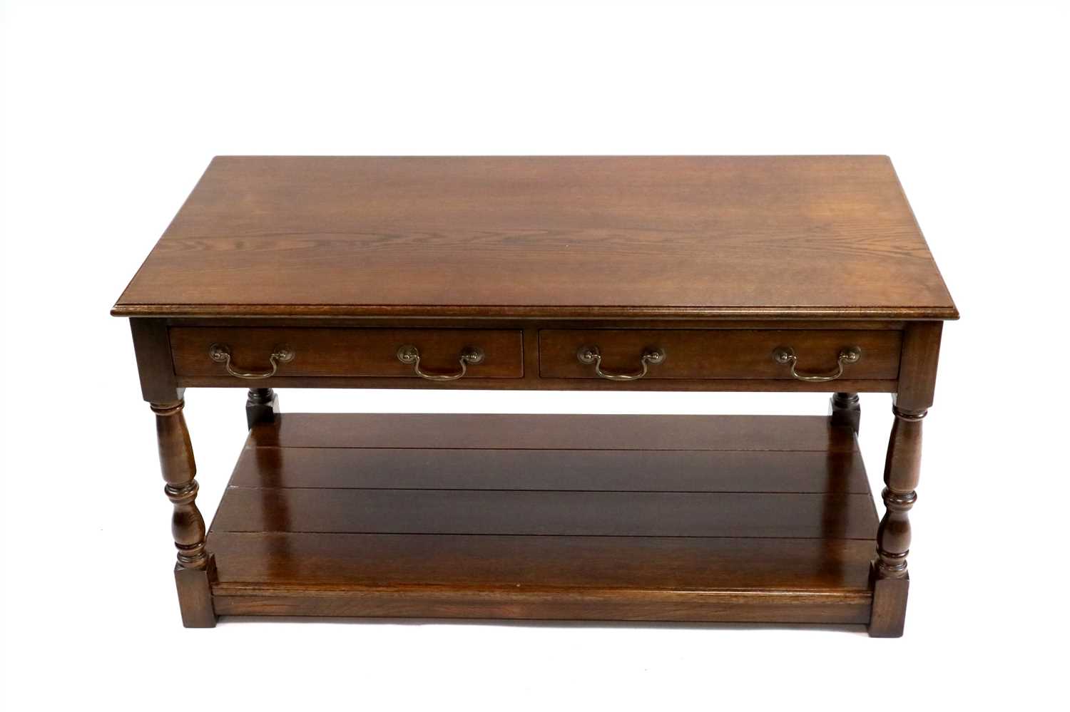 Lot 706 - A reproduction oak side table in the George III manner