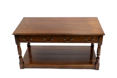 Lot 706 - A reproduction oak side table in the George III manner