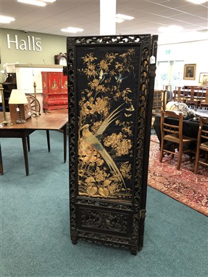 Lot 565 - A large 19th century Chinese carved hardwood four-fold screen with inset upholstered panels
