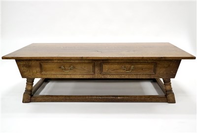 Lot 570 - A large and low reproduction oak coffee / centre table