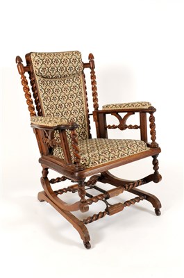 Lot 653 - A Victorian carved walnut framed upholstered sprung rocking chair