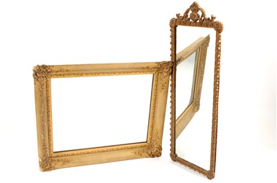 Lot 602 - An Indian brass tray / table on folding wooden stand and two wall mirrors