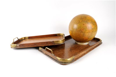 Lot 539 - A graduating pair of Edwardian brass-capped oak trays and a world globe lamp shade