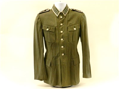 Lot 558 - A German Third Reich denim army tunic