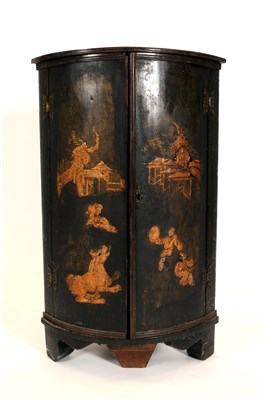 Lot 748 - A small late 18th century japanned barrel-fronted corner cupboard