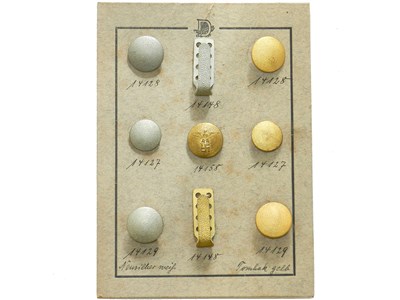 Lot 338 - German Third Reich salesman sample board of buttons