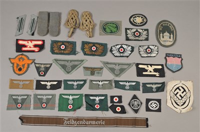 Lot 618 - Over 50 German Third Reich cloth badges - including reproduction
