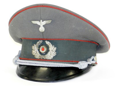 Lot 491 - A German Third Reich Army Artillery Officer’s visor cap by Pekuro