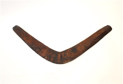 Lot 237 - A rustic hand-carved wood boomerang