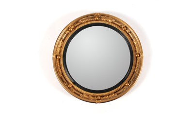 Lot 736 - A Regency style convex wall mirror by Atsonia in the Regency style