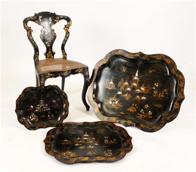 Lot 733 - Three Victorian lacquered graduated papier mache trays and a cane seated chair