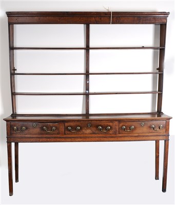 Lot 285 - A George III country oak dresser and rack of narrow proportions