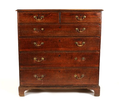 Lot 712 - A large George III country oak chest of drawers