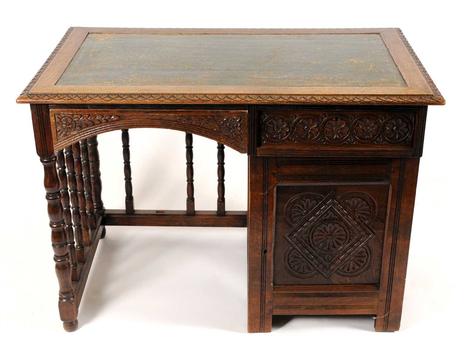 Lot 677 - An Edwardian oak single pedestal desk
