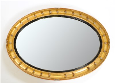 Lot 657 - A large 19th century oval gilt framed wall mirror