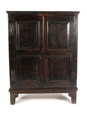 Lot 772 - A panelled country oak hall cupboard