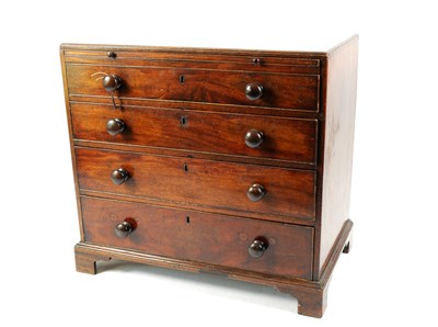 Lot 718 - A George III mahogany chest of four graduating long drawers