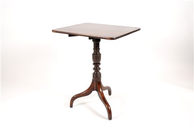 Lot 621 - A George III country oak snap-top table