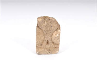Lot 800 - A weathered stylised carved limestone study of an owl