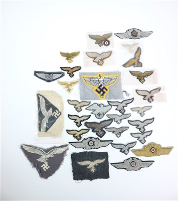 Lot 439 - Twenty German Luftwaffe visor cap eagles