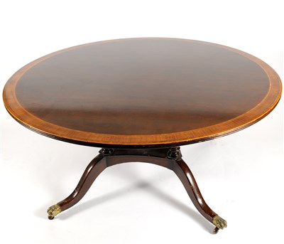 Lot 749 - A reproduction cross-banded mahogany dining table