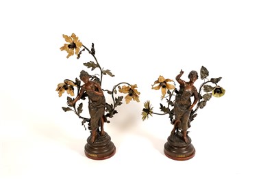 Lot 761 - A pair of decorative French spelter three light figural table lamps