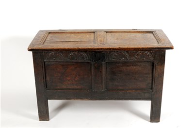 Lot 686 - An 18th century or earlier country oak panelled coffer