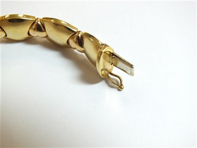 Lot 304 - Two yellow metal bracelets