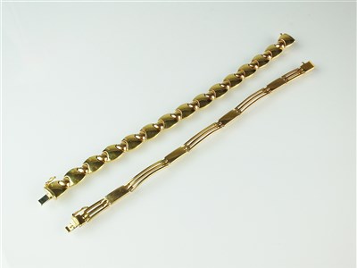 Lot 304 - Two yellow metal bracelets