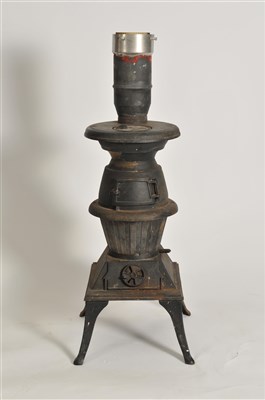 Lot 370 - A floor-standing cast iron log burner