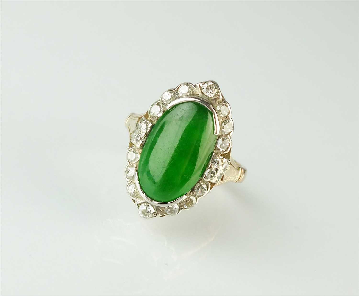 Lot 307 - A jade and diamond cluster ring