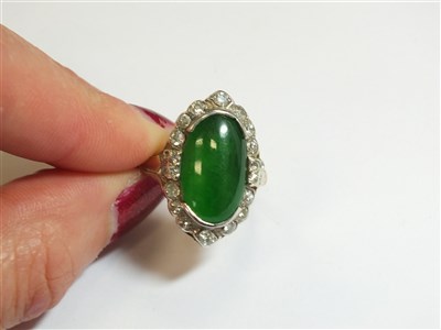 Lot 307 - A jade and diamond cluster ring