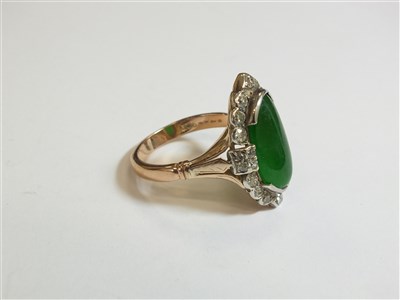 Lot 307 - A jade and diamond cluster ring