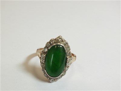 Lot 307 - A jade and diamond cluster ring