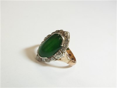 Lot 307 - A jade and diamond cluster ring