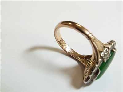 Lot 307 - A jade and diamond cluster ring