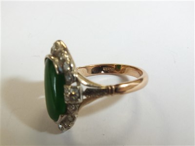 Lot 307 - A jade and diamond cluster ring