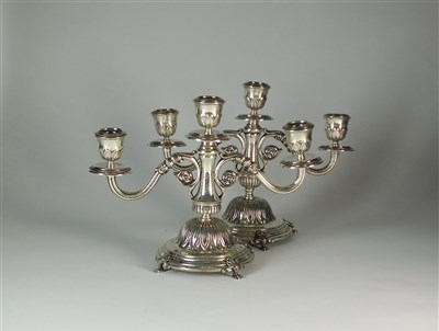 Lot 212 - A pair of Egyptian silver candelabra