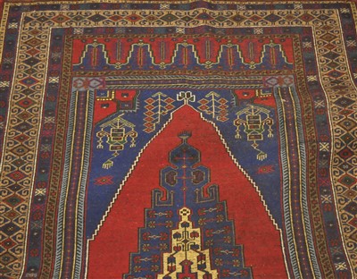Lot 827 - An Anatolian rug, the raspberry lozenge field...