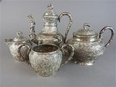Lot 55 - A Chinese Canton export silver four piece tea...