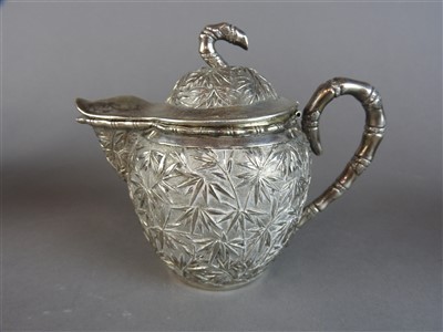 Lot 55 - A Chinese Canton export silver four piece tea...