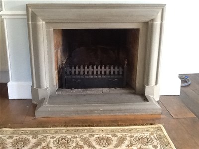 Lot 505 - A large sectional cast composite stone fire surround