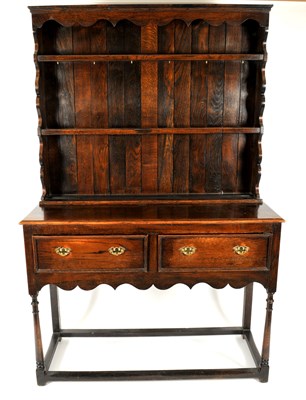 Lot 267 - An early 20th century oak dresser, the shaped...