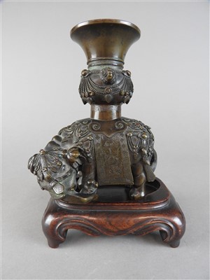 Lot 56 - A Chinese bronze and gemset elephant incense...
