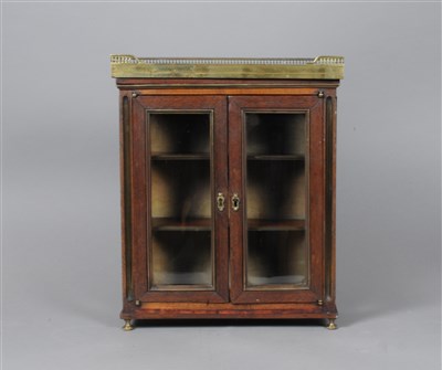 Lot 240 - A Victorian miniature rosewood marble-topped bookcase